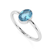 swiss blue topaz oval cut stackable bezel-set ring