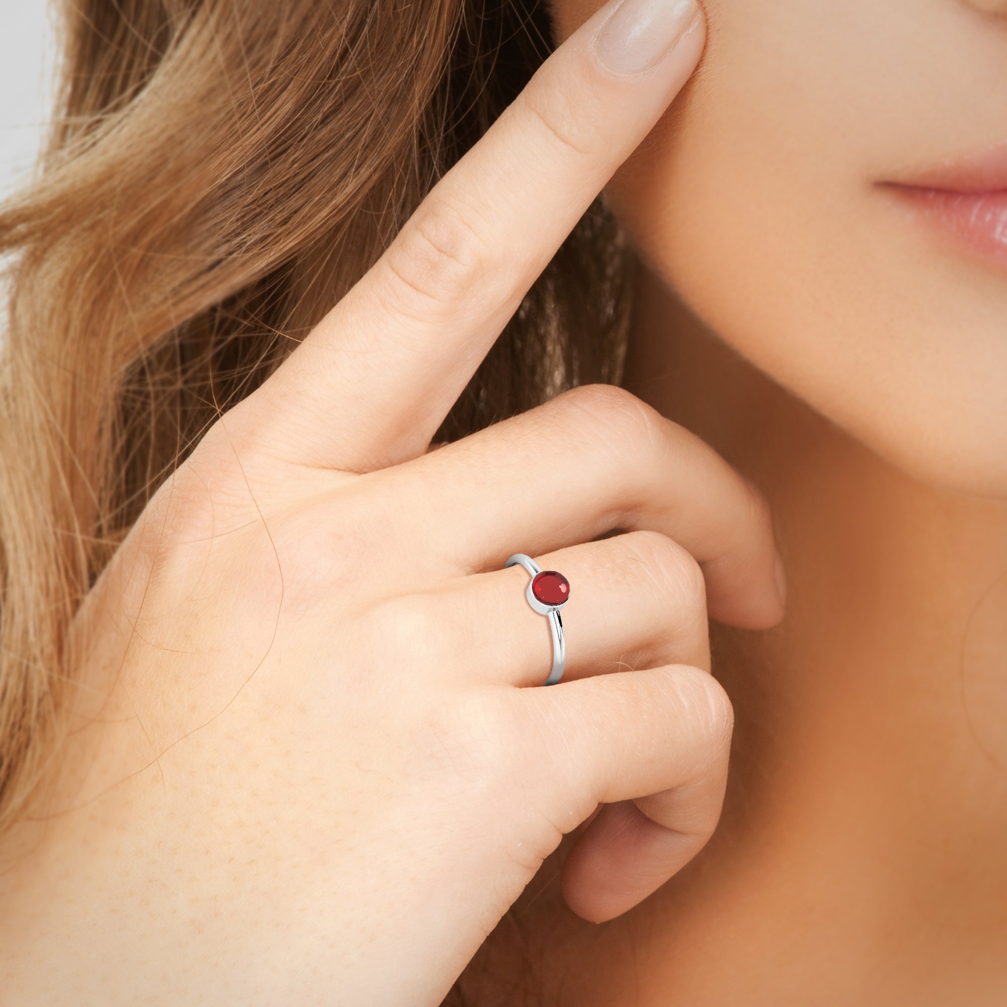 red garnet round cab stackable bezel-set ring